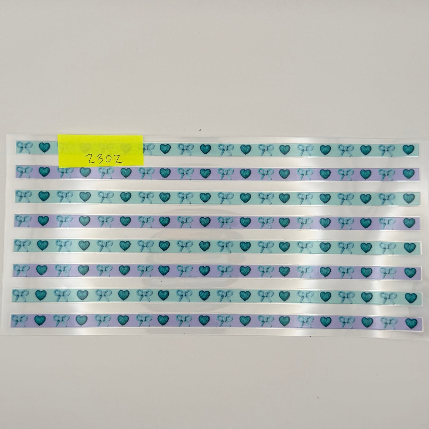 teal lines, hearts and bows