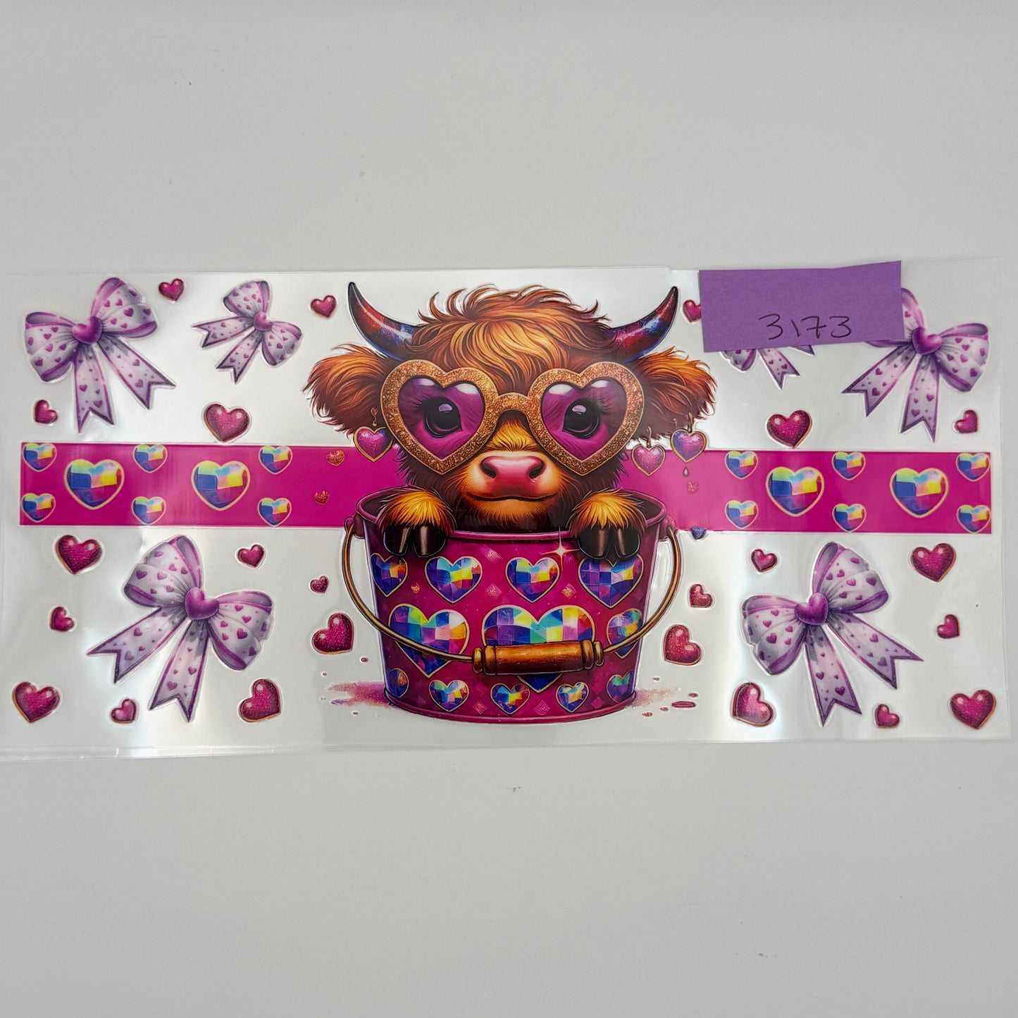 Highland Cow with heart glasses in bucket