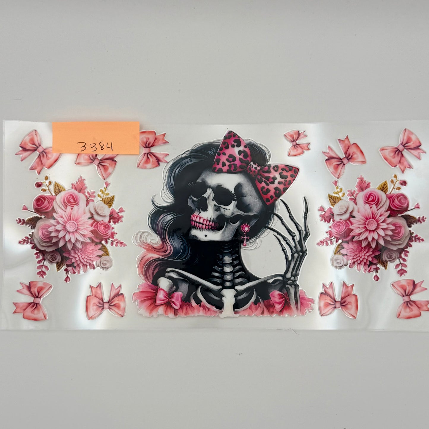Pink skull with flowers and bows