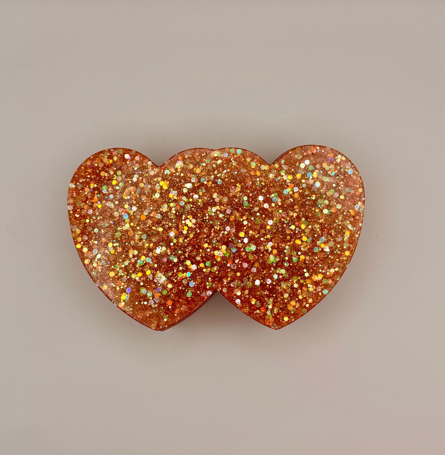 Double heart-shaped container with glitter lid
