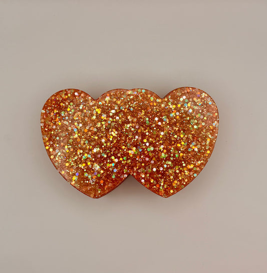 Double heart-shaped container with glitter lid