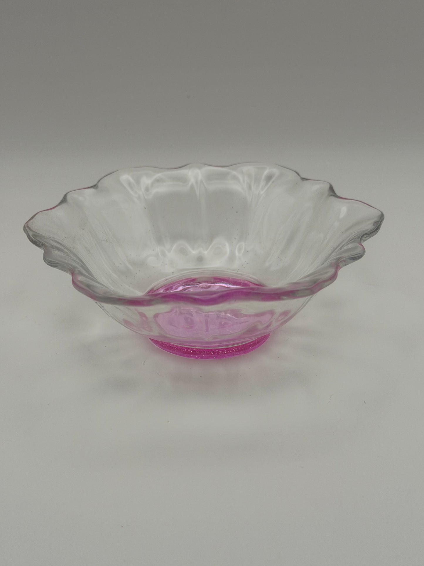 Small clear with purple hue flower-shaped bowl