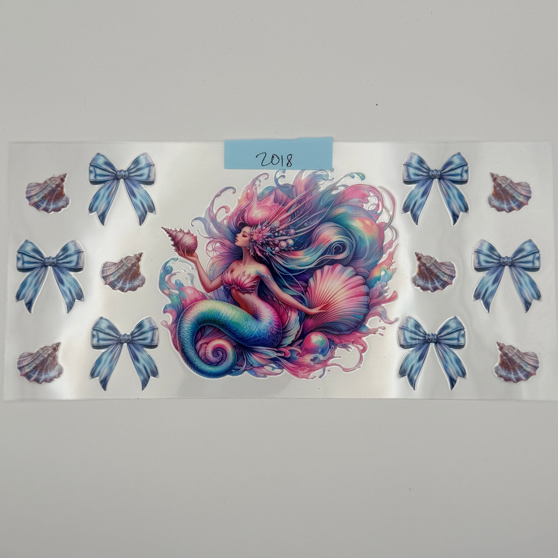 mermaid with bows and shell
