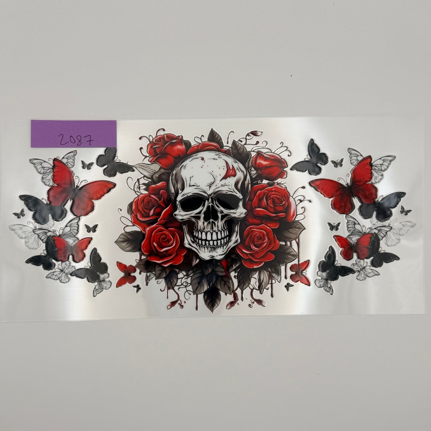 skull with red flowers and butterflies