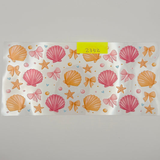 yellow, pink shells and bows