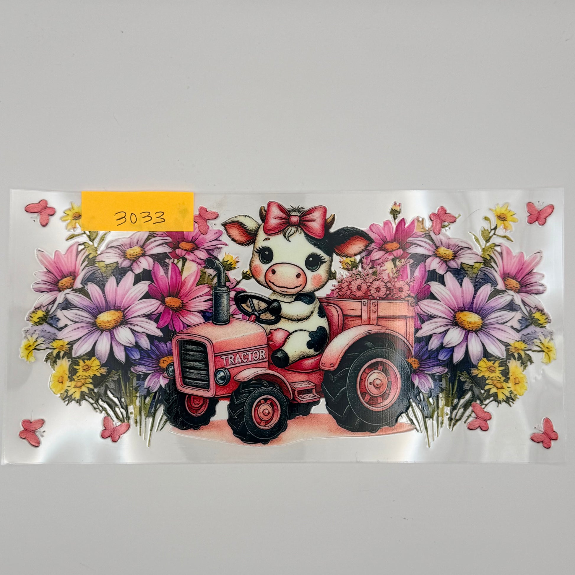 cute cow on a tractor with flowers