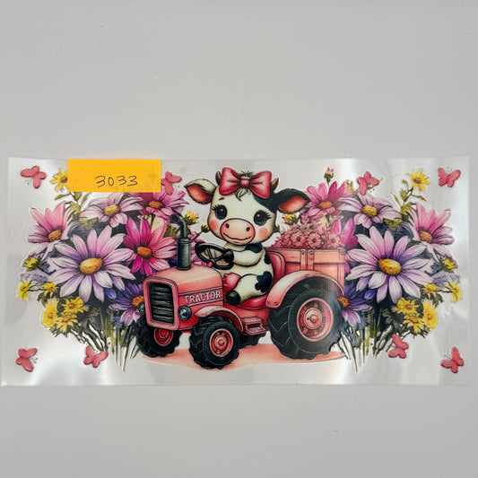 cute cow on a tractor with flowers